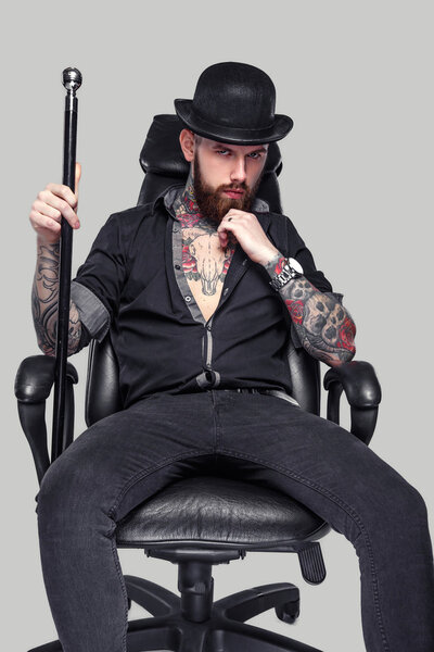 Bearded tattooed guy with walking stick