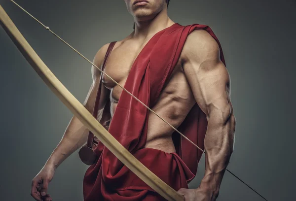 Muscular male model with bow — Stock Photo, Image