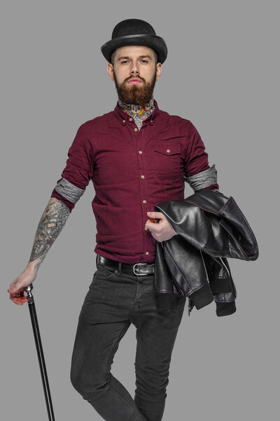 Bearded tattooed guy with walking stick