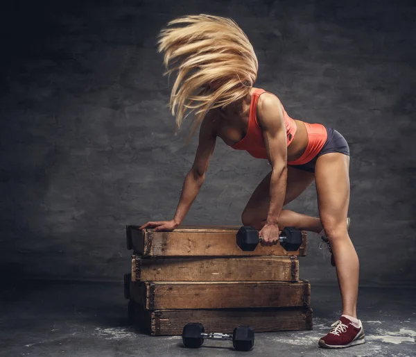 Female with dumbbells in action — Stock Photo, Image