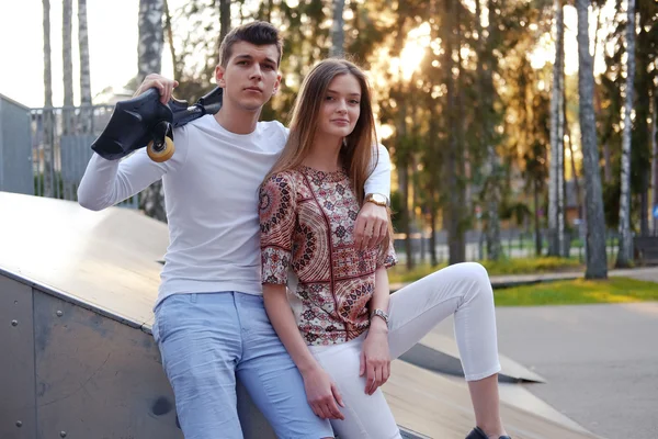 Casual couple in a skate park.