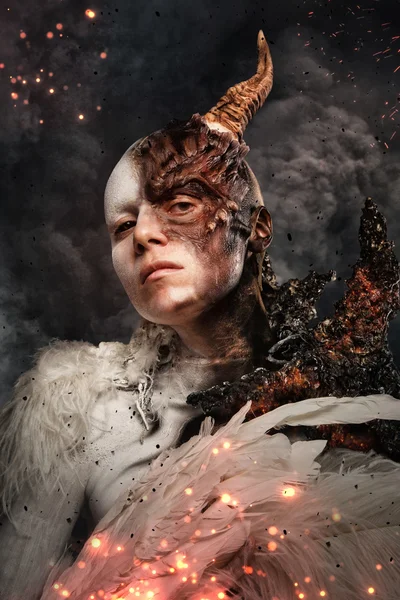 Devil woman with horn in a fire — Stock Photo, Image