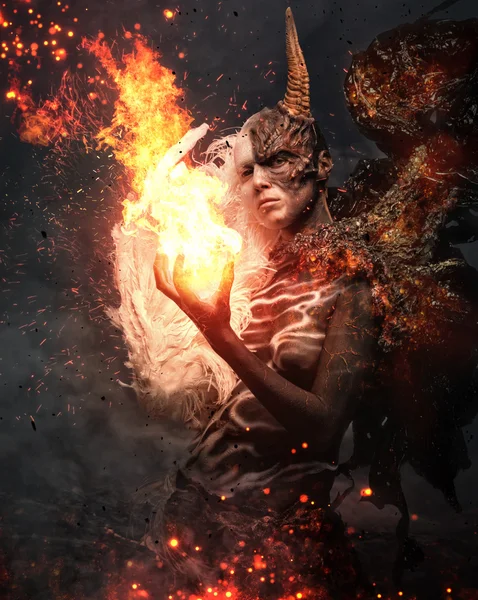 Devil woman with horn in a fire — Stock Photo, Image