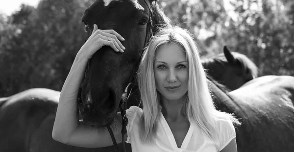 Portrait of blond woman with horse. — Stock Photo, Image