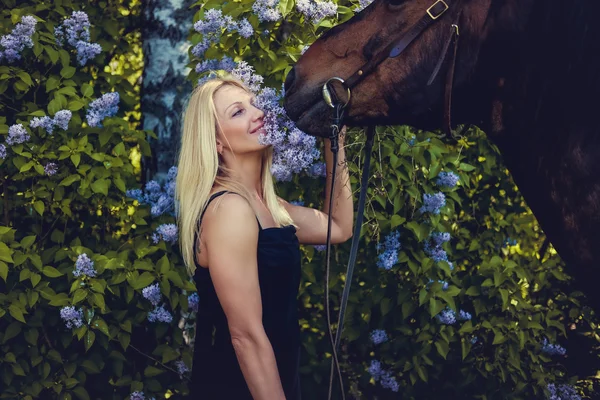 Portrait of blond female with horse. — Stock Photo, Image
