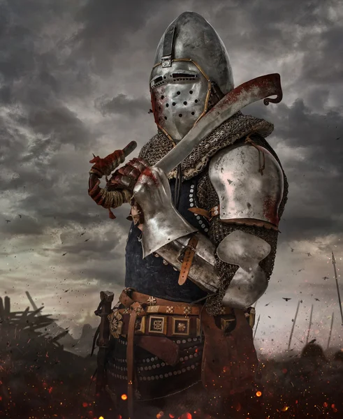 Knight with sword in battlefield — Stock Photo, Image