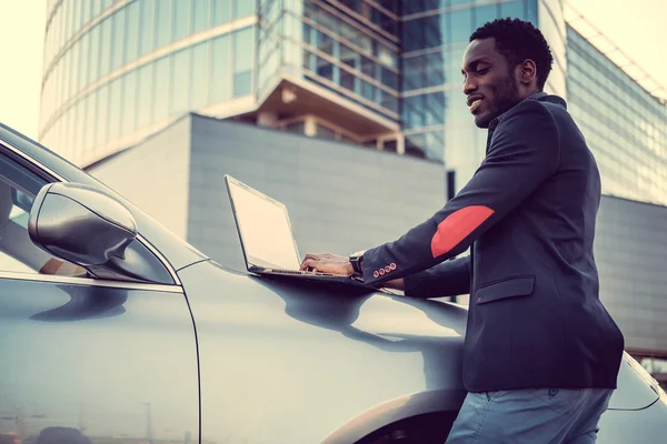 Stylish african male using laptop — Stock Photo, Image