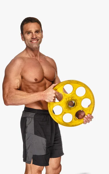 Masculino segurando peso barbell amarelo — Fotografia de Stock