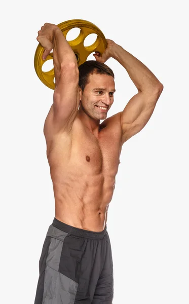 Erkek holding sarı halter ağırlık — Stok fotoğraf