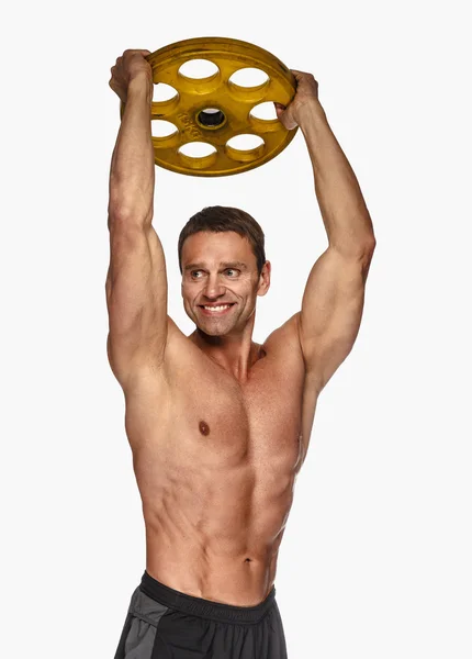 Erkek holding sarı halter ağırlık — Stok fotoğraf