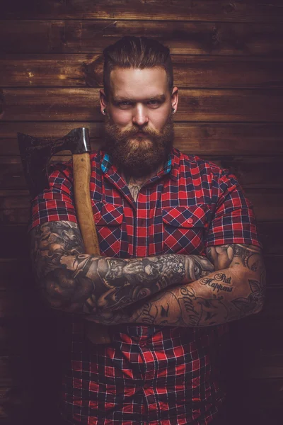 Bearded male holding axe. — Stock Photo, Image