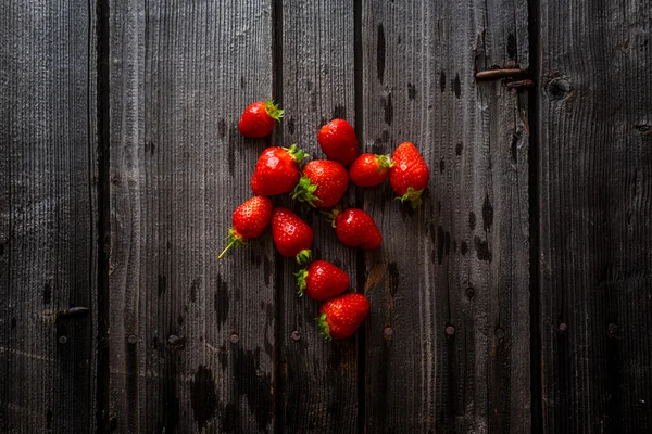 Strawberries on a wooden desk — Stock Photo, Image