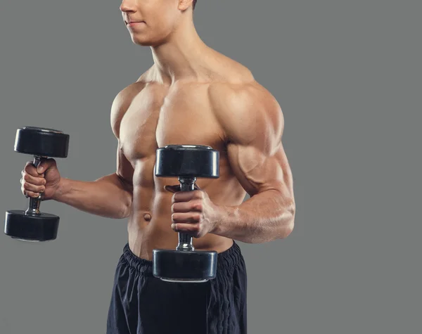 Male doing biceps exercises with dumbbells — Stock Photo, Image