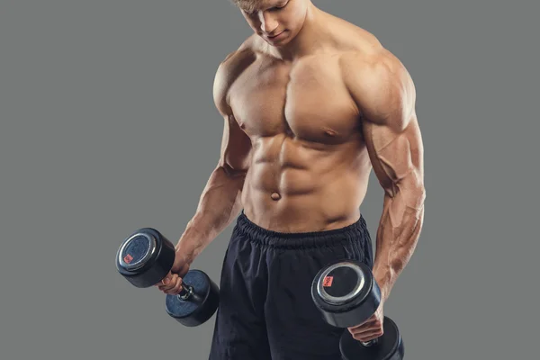 Male doing biceps exercises with dumbbells — Stock Photo, Image