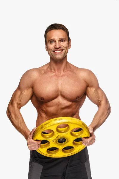 Male holding yellow barbell weight — Stock Photo, Image