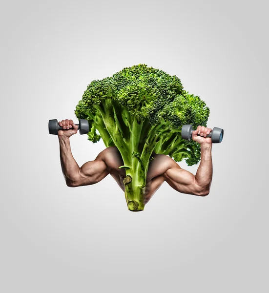 Brócoli con manos de hombre musculoso . —  Fotos de Stock