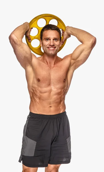 Masculino segurando peso barbell amarelo Imagens Royalty-Free