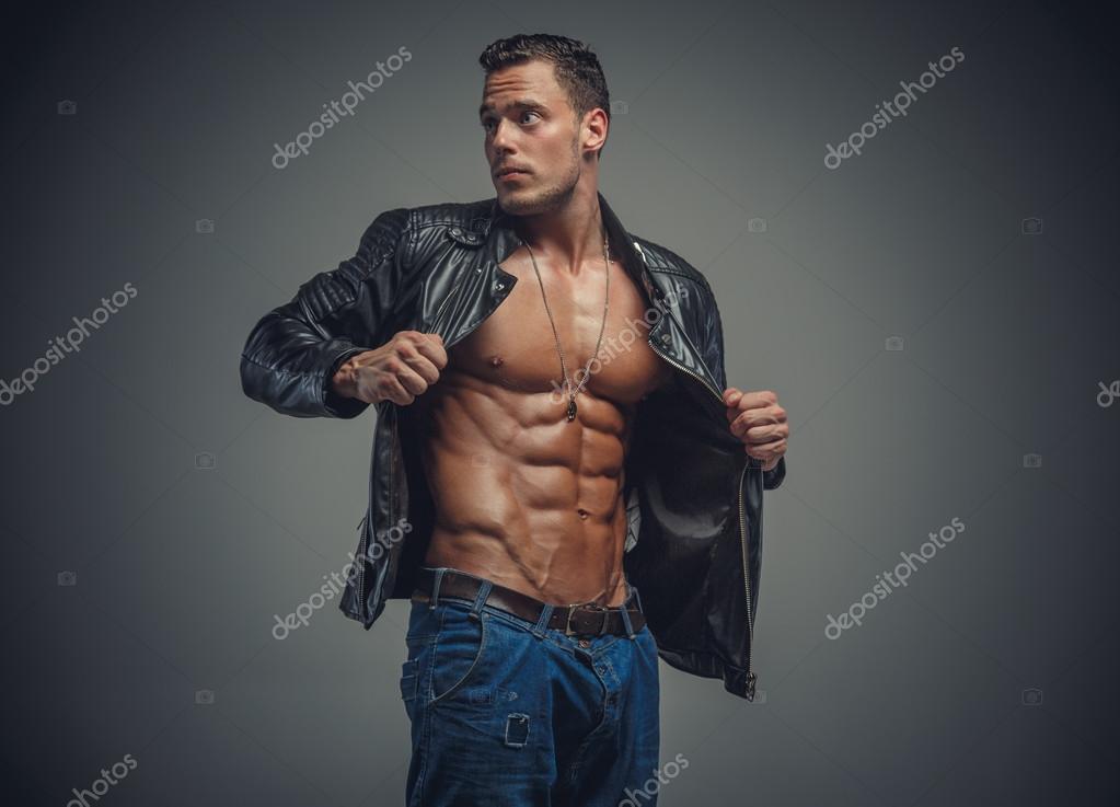 Athletic male model in leather jacket Stock Photo by ©fxquadro 114131566