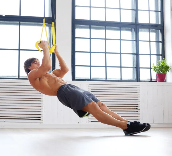 Male exercising with fitness trx straps — Stock Photo, Image