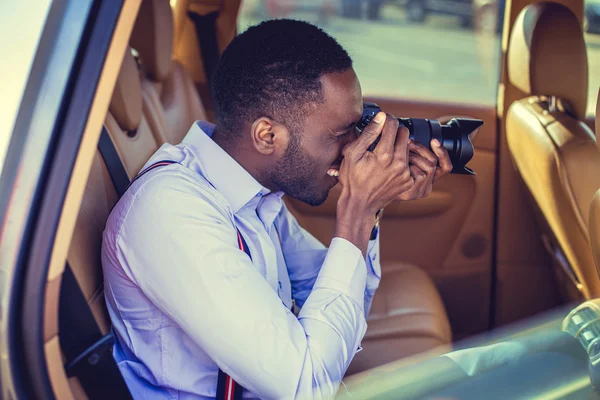 African man shooting with dslr camera