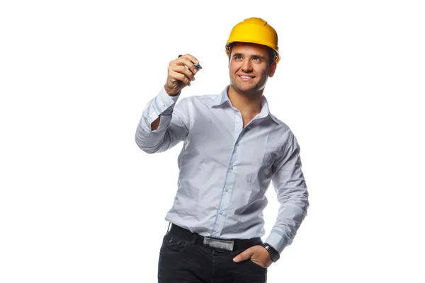 Male in safety helmet holding a pen — Stock Photo, Image