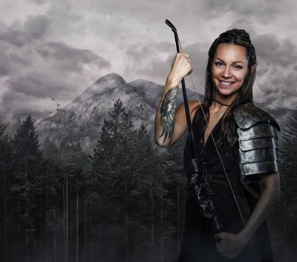 Elf woman in armor holding bow — Stock Photo, Image