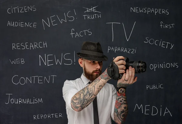 Bearded photographer with tattooes