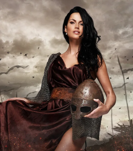 Attractive war queen holding helmet — Stock Photo, Image