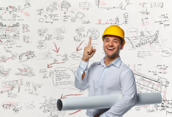 Engenheiro trabalhador com tubo de desenho — Fotografia de Stock