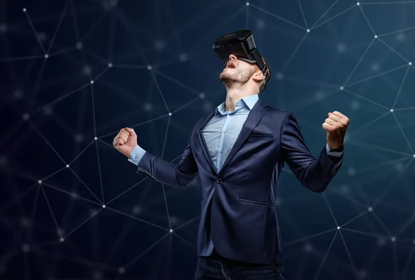 Exciting male in a suit with virtual glasses — Stock Photo, Image