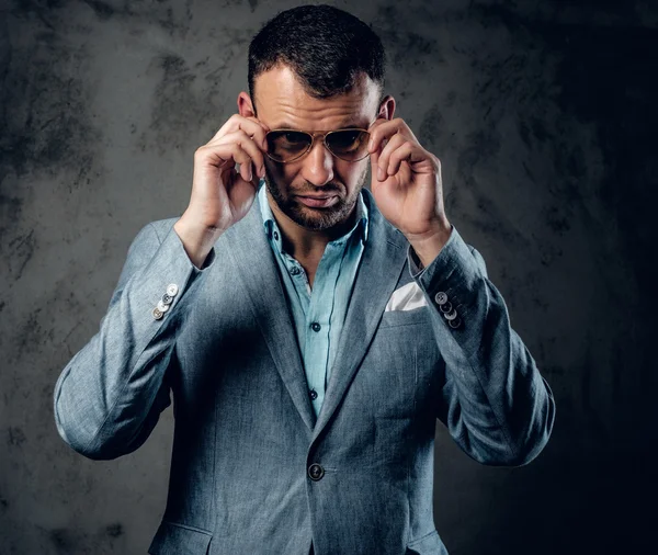 Male in azure jacket and sunglasses — Stock Photo, Image