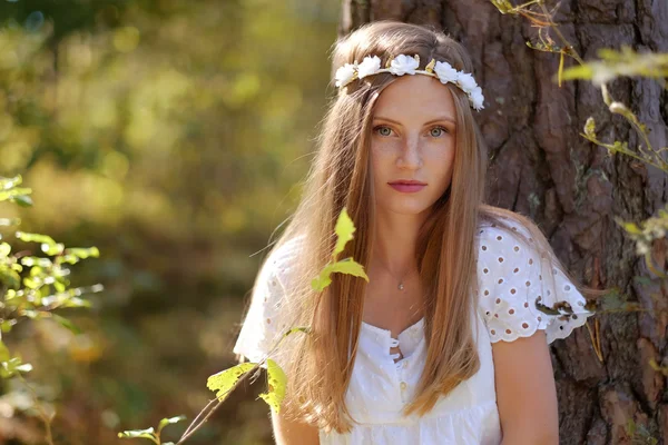 Freckled woman with circlet of flower — Stock Photo, Image