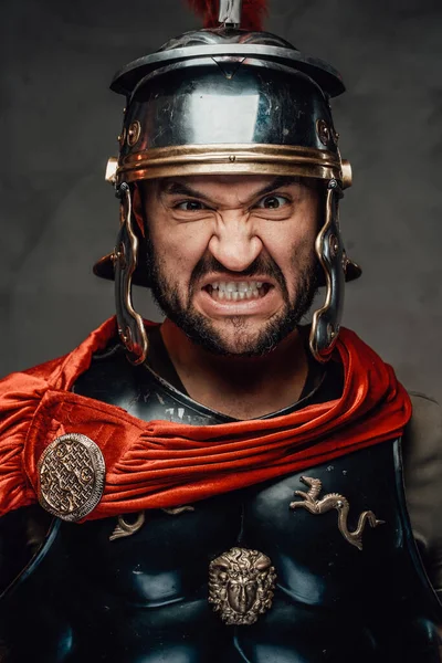 Savage and anrgy roman warrior with armour — Stock Photo, Image