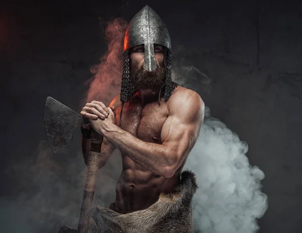 Legendary viking with naked torso in smoky background with axe — Stock Photo, Image