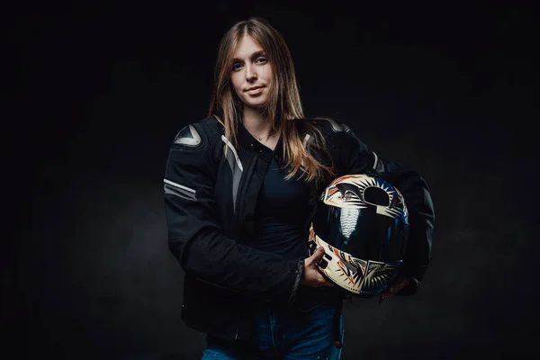Female biker in black jacket with long hairs in dark background — Stock Photo, Image