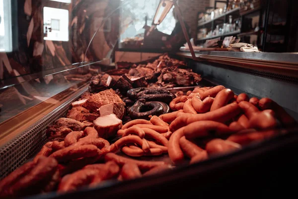 Butchers shop indoors and huge choice of raw and smoked meat — Stock Photo, Image