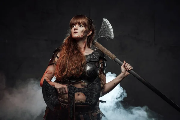 Scandinavian female conqueror armed with axes — Stock Photo, Image