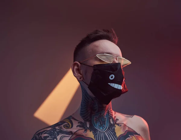 Individual caucasian hipster with black mask and sunglasses in studio — Stock Photo, Image