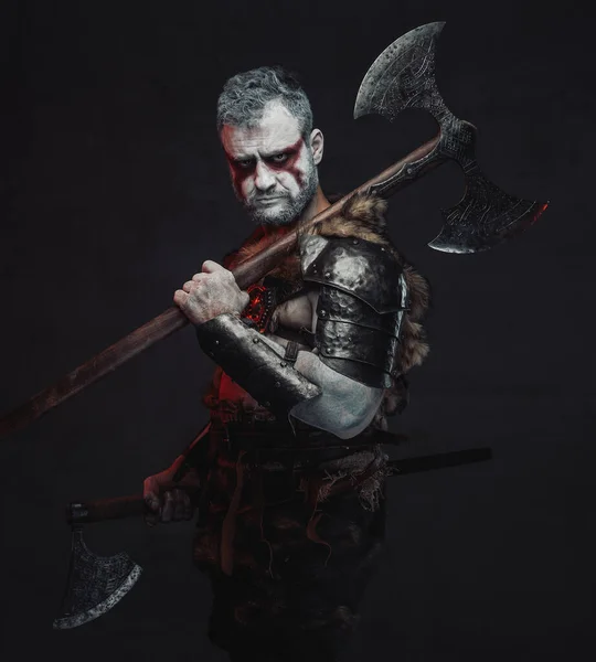 Dangerous fantasy warrior wih two axes in dark background — Stock Photo, Image