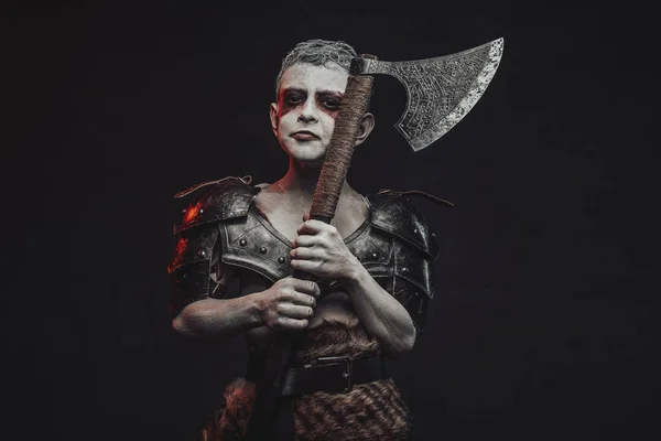 Fantasy little soldier from the past with axe in dark background — Stock Photo, Image