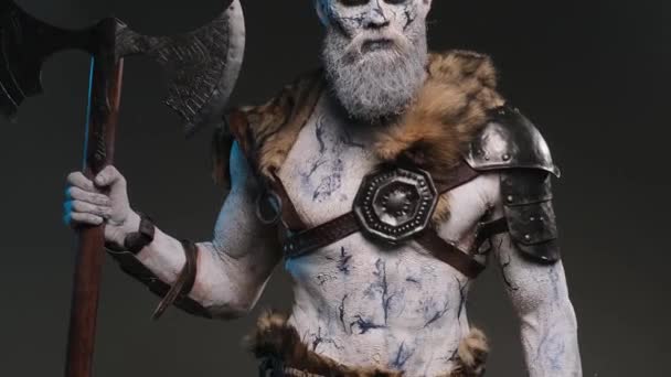 Evil fashion of dead warrior with axe in dark background — Stock Video