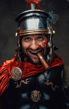 Dumb imperial soldier from rome smoking cigar in dark background