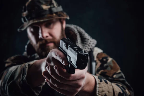 Armed with modern handgun guy in camouflage equipment — Stock Photo, Image