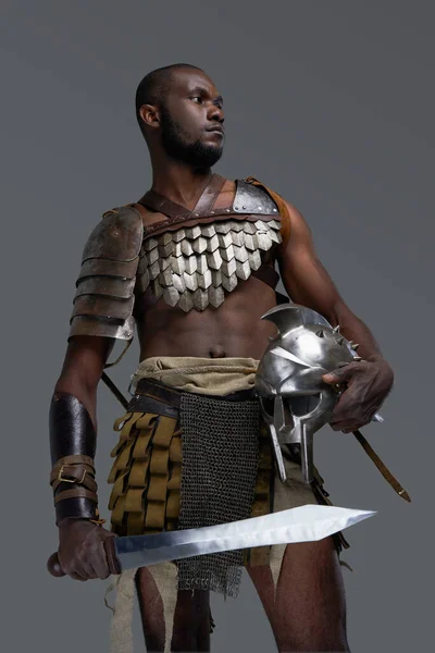 Roman gladiator of african ethnic with sword — Stock Photo, Image