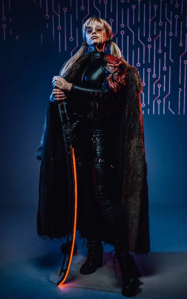 Proud cyberpunk woman with fur holding her blade — Stock Photo, Image