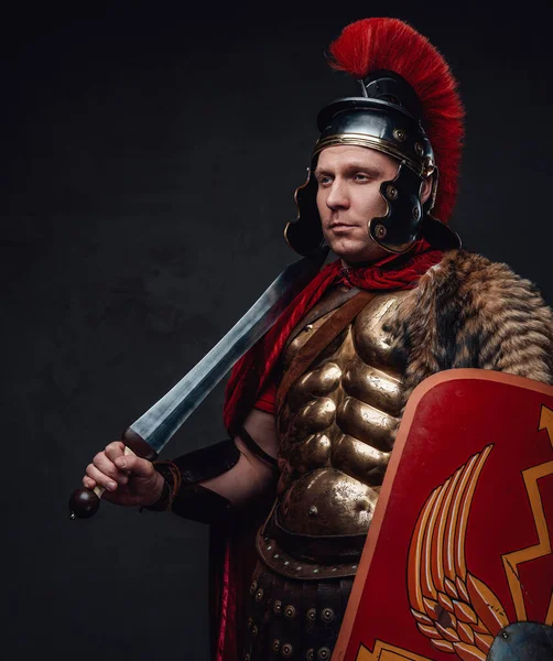 Imperial warrior with gladius on his shoulder — Stock Photo, Image