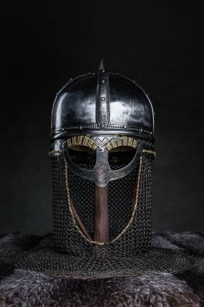 Single medieval helmet on stick around fur — Stock Photo, Image