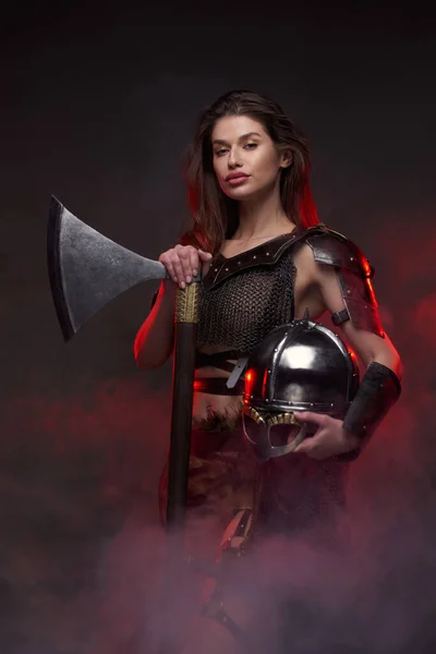 Nordic woman barbarian with axe in fog — Stock Photo, Image