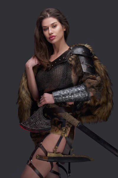 Female northern warrior in armor with fur coat — Stock Photo, Image