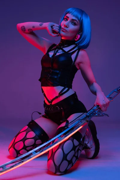 Stylish cyberpunk girl with blue hairs and glowing sword — Φωτογραφία Αρχείου